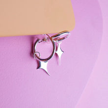  Small silver hoop earrings with a star shaped charm 