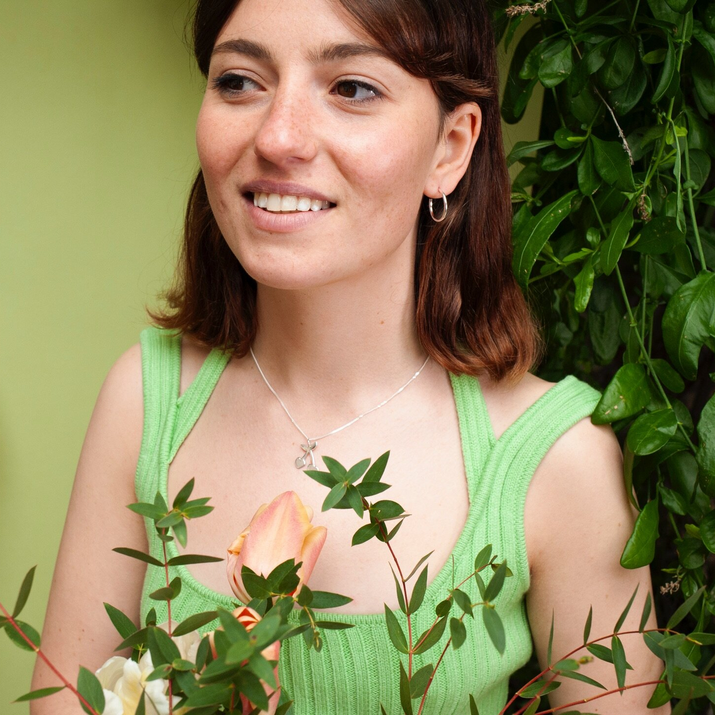 Woman wearing small silver hoop earring