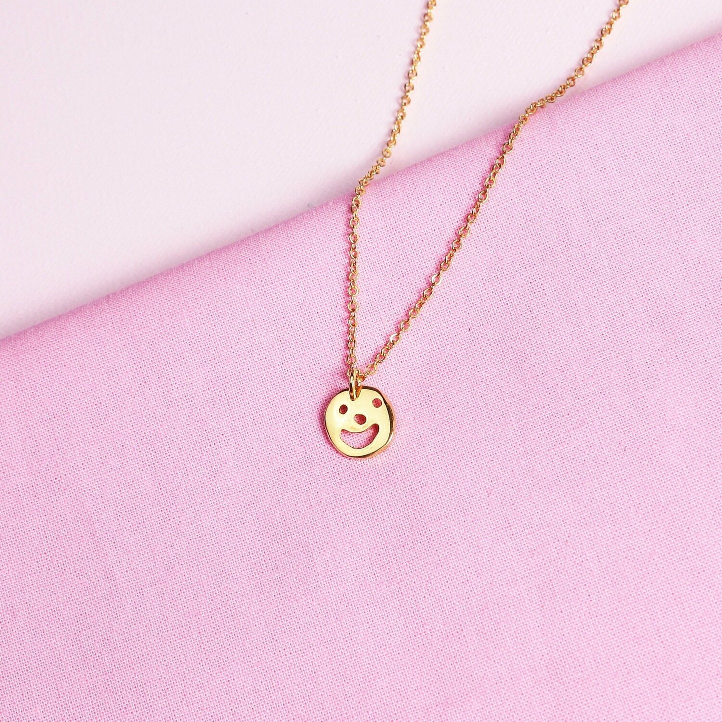 Close up of gold Smiley Necklace