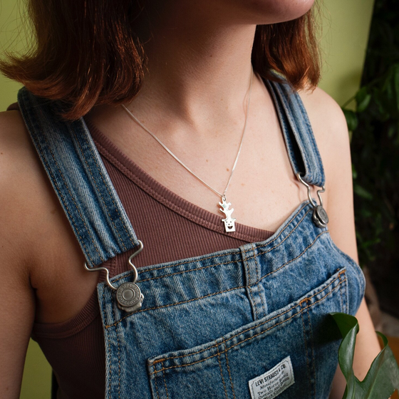 Woman wearing silver Smiley Plant Pot Necklace