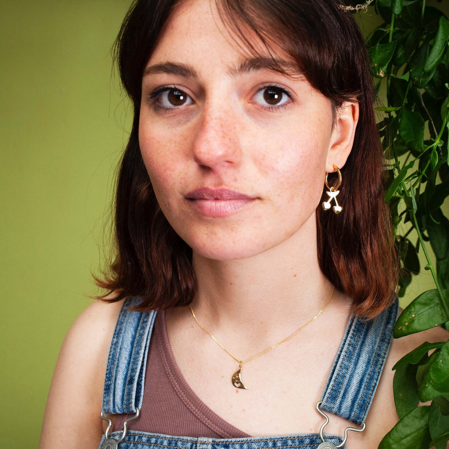 Woman wearing gold Smiley Moon Necklace