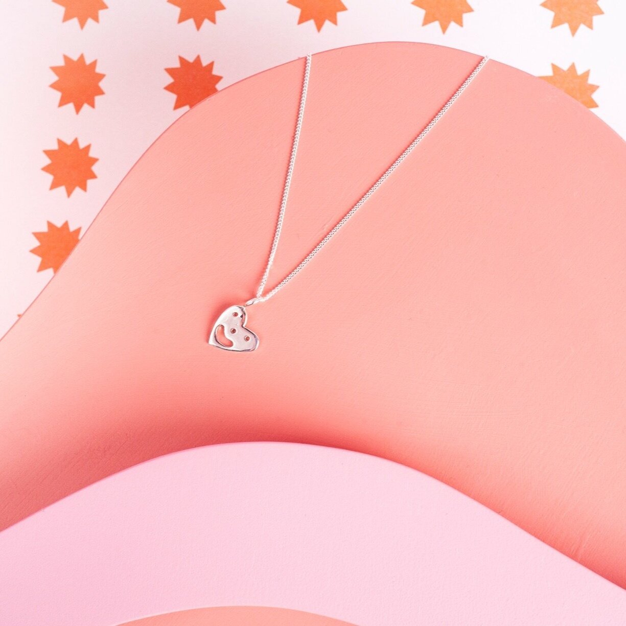 Pendant chain necklace with a smiling heart charm