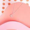 Pendant chain necklace with a smiling heart charm
