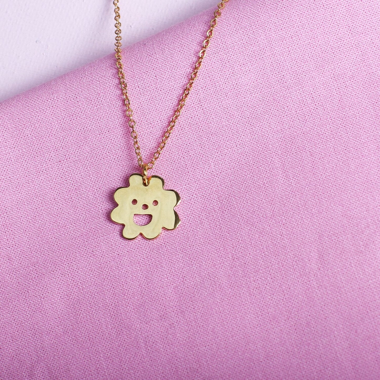 Close up of gold Smiley Flower Necklace