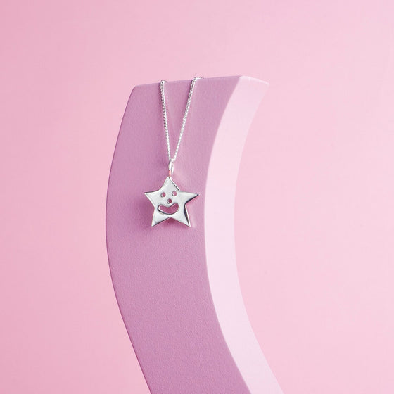 Close up of silver Smiley Star Necklace