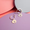 Close up of silver Smiley Flower Hoops earrings