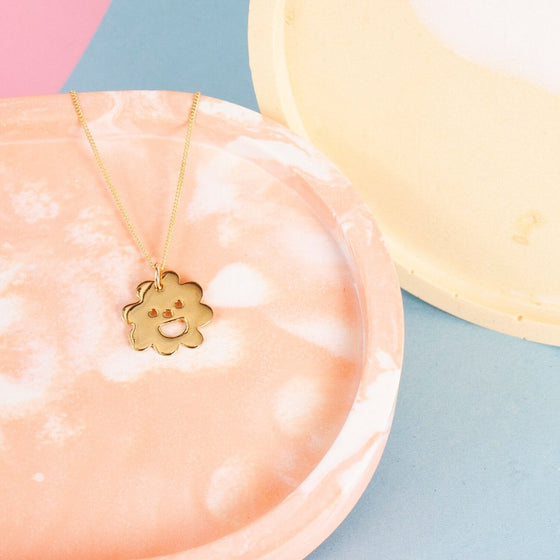 Close up of gold Smiley Flower Necklace
