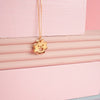 Close up of gold Smiley Flower Necklace
